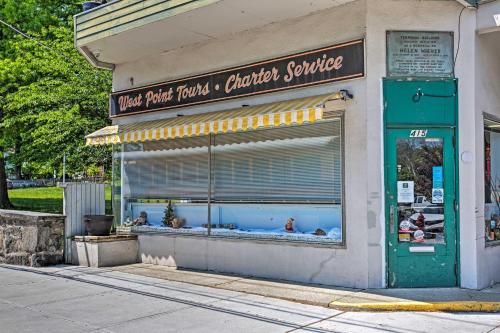 a store with a large aquarium in a window at Updated Home with Patio Half Mile to West Point in Highland Falls