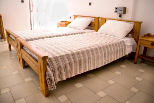 Cama o camas de una habitación en Popi Hotel Apartments