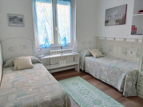 A bed or beds in a room at La Pervinca