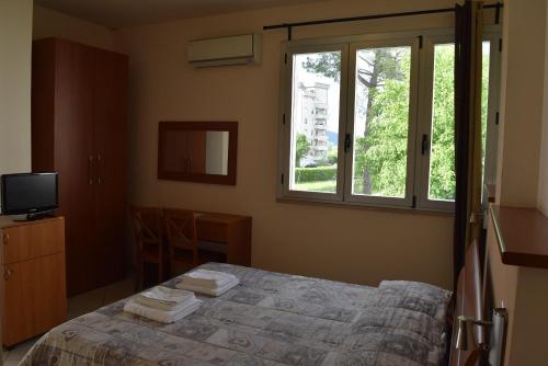 Postel nebo postele na pokoji v ubytování La Dea