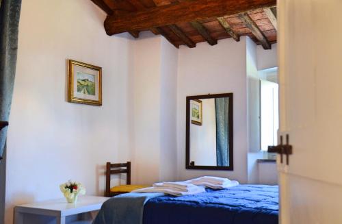 מיטה או מיטות בחדר ב-Casa "IL BRIO"