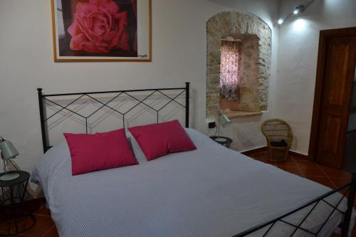 A bed or beds in a room at La Rocchetta