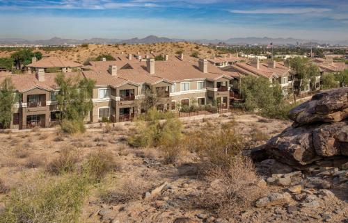 an aerial view of a subdivision of houses at Raintree at Phoenix South Mountain Preserve in Phoenix