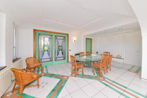 a dining room with a table and chairs at Villa Stefania in Ischia