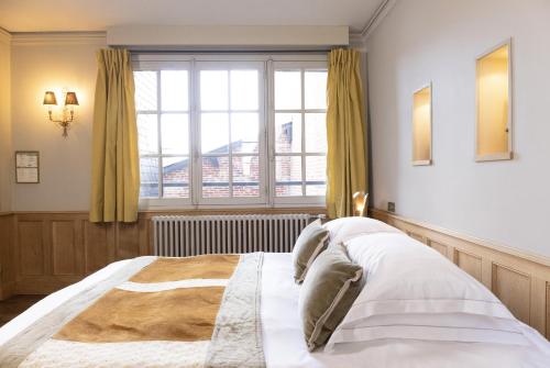 Letto o letti in una camera di La Maison De Lucie