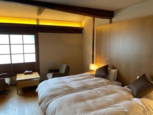 מיטה או מיטות בחדר ב-PAYSAGE MORIGUCHI - Vacation STAY 32994v