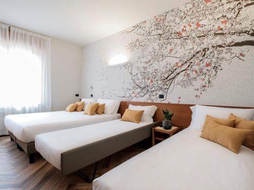Postel nebo postele na pokoji v ubytování Hotel Lory