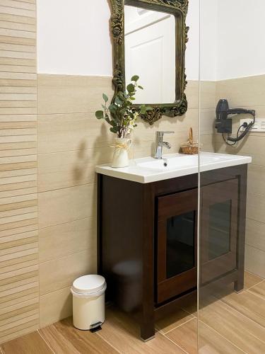 a bathroom with a sink and a mirror at Villaprado in Cambados