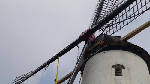 a windmill with a window on top of it at Hotel Willemstad in Willemstad