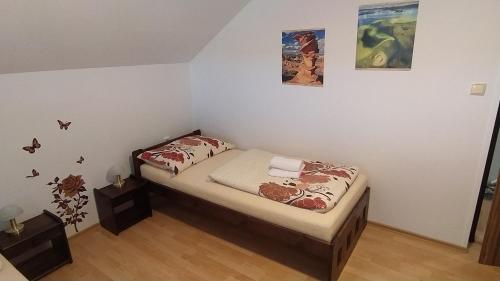 Postel nebo postele na pokoji v ubytování Apartmán U Špýcharu