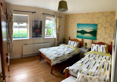 Postel nebo postele na pokoji v ubytování Lakeview House B&B
