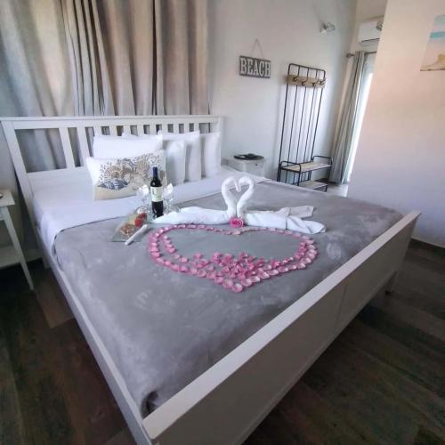 a bed with a heart made out of pillows at La Jamaca - An Island Vibe Hotel in La Parguera