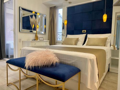 a bedroom with a large bed with a blue headboard at Luxury Studio apartment Marinovic in Makarska