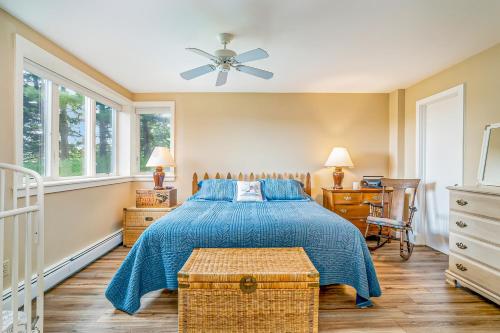 a bedroom with a bed and a ceiling fan at Birchwood: Meadows Bliss in Harbor Springs