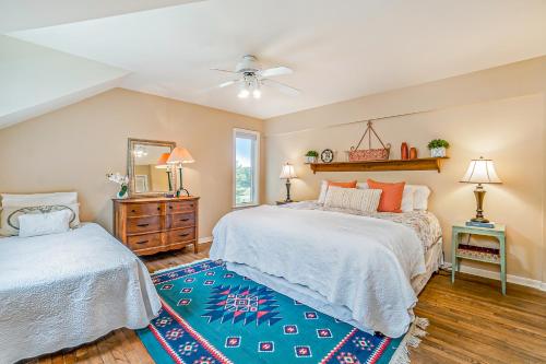 a bedroom with two beds and a ceiling fan at Birchwood: Meadows Bliss in Harbor Springs