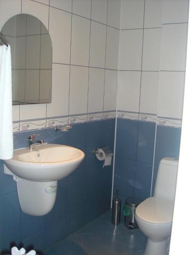 a bathroom with a sink and a toilet at Complex FREYA S - All Inclusive Light in Obzor