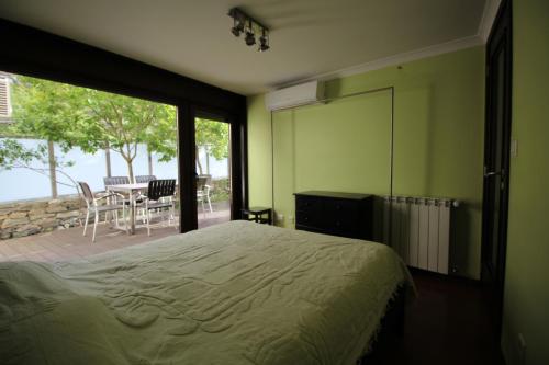 Кровать или кровати в номере Casa do Rio Fervença