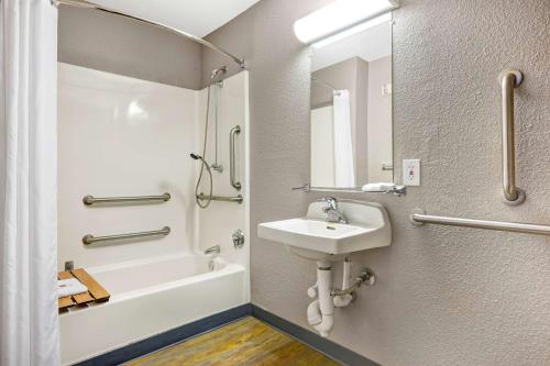 a bathroom with a sink and a toilet and a tub at Motel 6-Issaquah, WA - Seattle - East in Issaquah