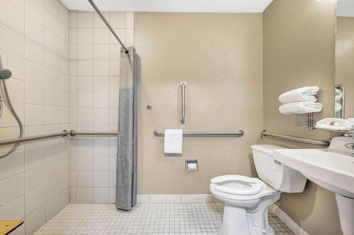 a bathroom with a toilet and a sink at Studio 6-Mountlake Terrace, WA - Seattle in Mountlake Terrace