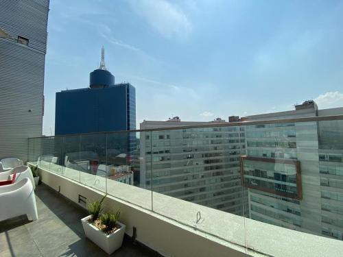 a balcony with a view of a large building at WTC Suites in Mexico City