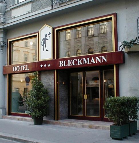 a hotel with a sign on the front of a building at Hotel-Pension Bleckmann in Vienna
