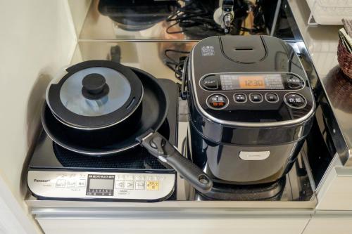 a coffee maker is sitting in a drawer at Le Soleil Asato in Naha