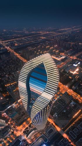 a view of a building with a funnel shaped roof at Niccolo Suzhou in Suzhou