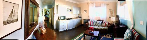 a living room with a couch and a table at Rollezz Villas Beach Resort in Old Bight