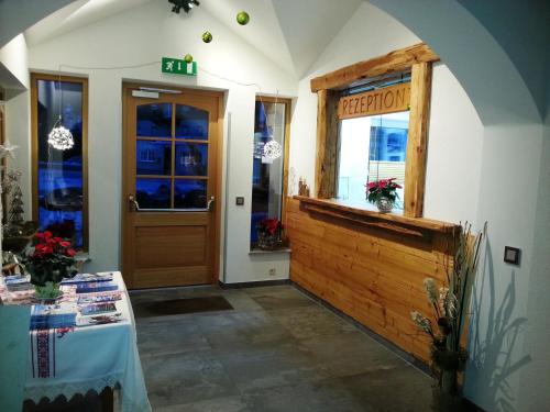 an entrance to a restaurant with a wooden door at Gasthof Gosauschmied in Gosau