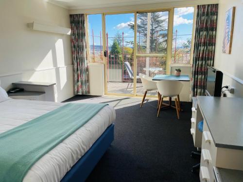 Postel nebo postele na pokoji v ubytování Parklane Motel