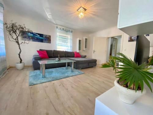 a living room with a couch and a table at Apartment Stella in Bad Ischl