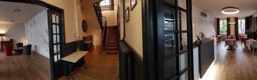 a hallway of a house with a dining room at Hotel de La Paix in Oloron-Sainte-Marie