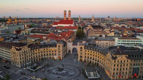 an aerial view of the city of vienna at sunset at Yours Truly in Munich
