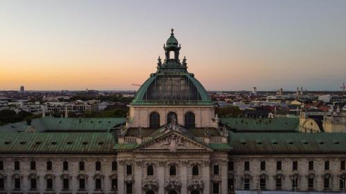 a building with a tower on top of it at Yours Truly in Munich