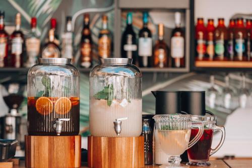two drink bottles sitting on top of a bar at Amoessa Boutique - Adults Only in Polykhrono