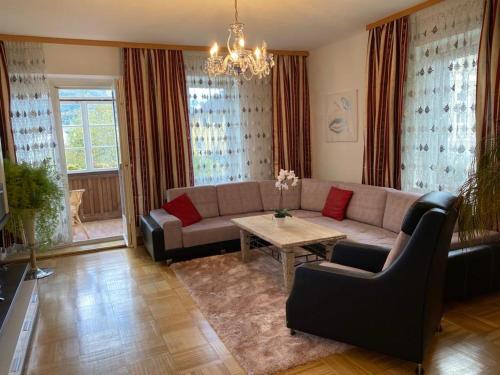 a living room with a couch and a table at Apartment Stella in Bad Ischl
