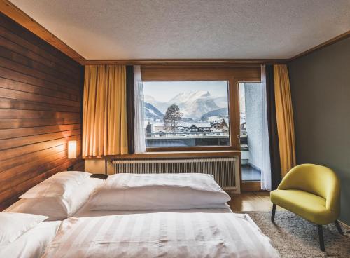 Postel nebo postele na pokoji v ubytování BOUTIQUEHOTEL das edelweiss