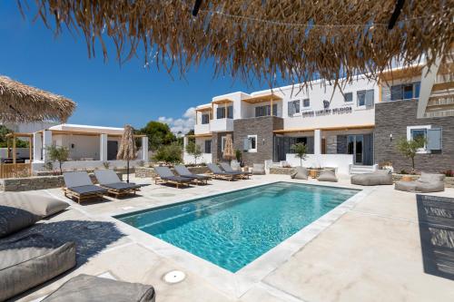 an image of a villa with a swimming pool at Drios Luxury Studios in Drios