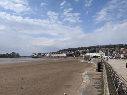 a view of a beach with buildings in the background at Parasol Weston Guest House in Weston-super-Mare