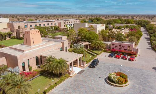 an aerial view of a city with buildings and palm trees at Welcomhotel by ITC Hotels, Jodhpur in Jodhpur