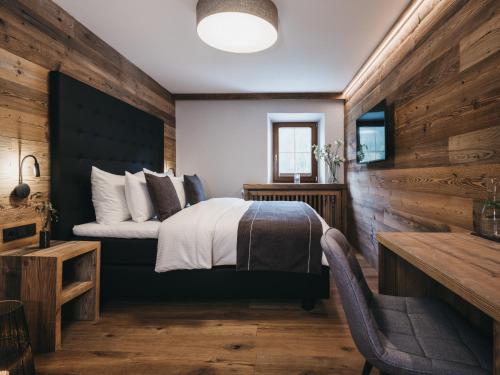 
Ein Bett oder Betten in einem Zimmer der Unterkunft VAYA Post Saalbach
