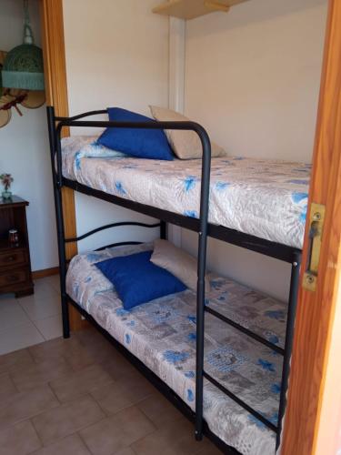 a couple of bunk beds in a room at Carmen House in Grottammare