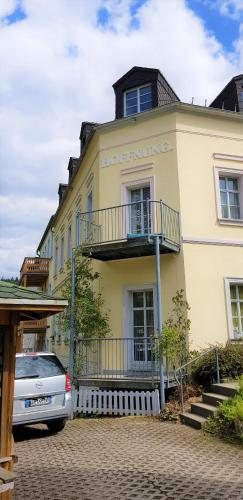 a building with a car parked in front of it at Villa Hoffnung in Bad Elster