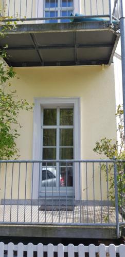 a balcony with a door on a house at Villa Hoffnung in Bad Elster