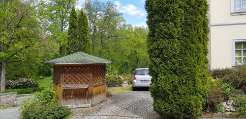 a house with a wooden structure in a yard at Villa Hoffnung in Bad Elster