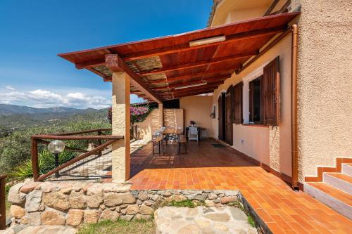 a porch of a house with a wooden roof at Villa Gianna in Torre delle Stelle