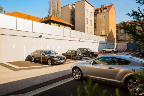 a group of cars parked in a parking lot at Best Western Premier Hotel Astoria in Zagreb