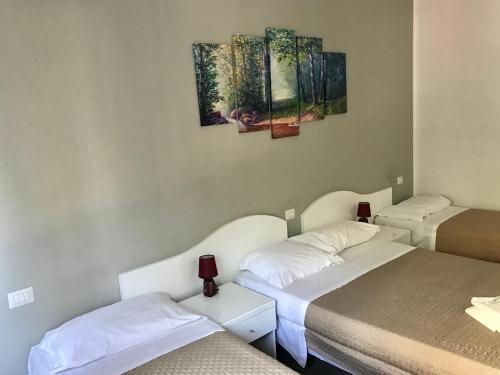 Postel nebo postele na pokoji v ubytování Guest House Brianza Room