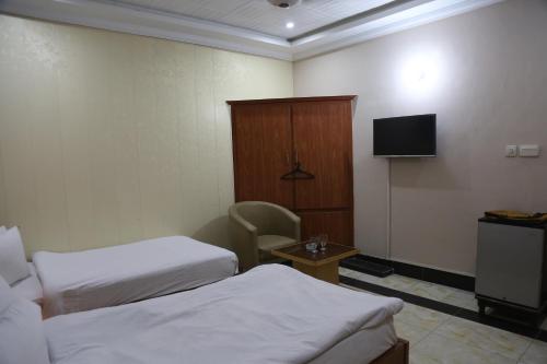 Postel nebo postele na pokoji v ubytování The King Hotel