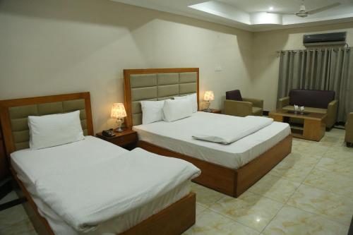 מיטה או מיטות בחדר ב-The King Hotel